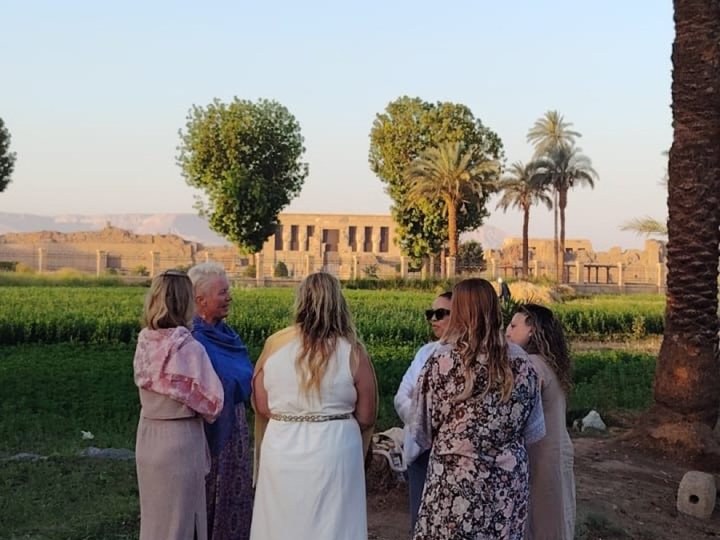 Women gathered together in front of Dendera Temple